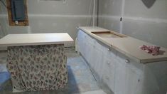 an unfinished bathroom with a sink and counter