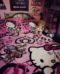 a hello kitty bed with pink sheets and pillows