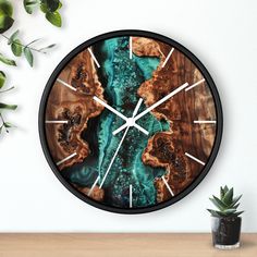 a clock that is on the wall next to a potted plant and some plants