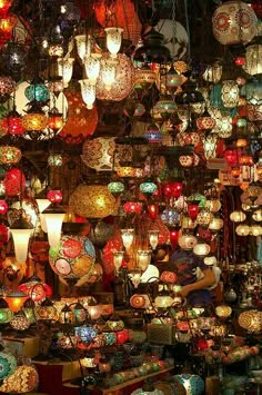 many colorful lights are hanging from the ceiling