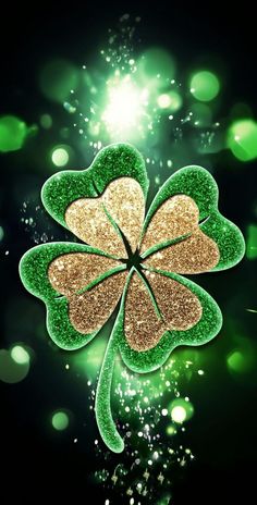 four leaf clover with sparkles in the background