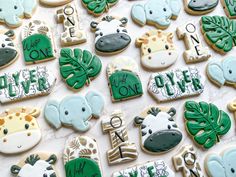 many decorated cookies are arranged on a table