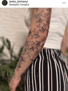 a person with a flower tattoo on their arm