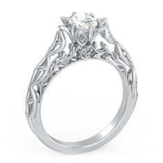 a white gold engagement ring with an intricate design