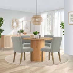 a dining room table with four chairs around it