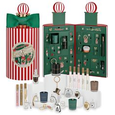 an assortment of christmas themed items in a gift box with the contents open and on display