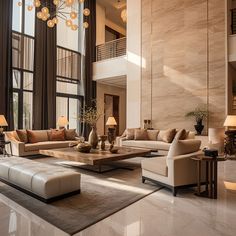 a living room filled with lots of furniture next to tall windows on top of a white floor