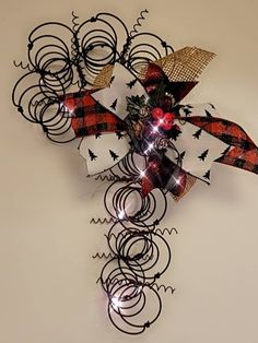 a christmas decoration made out of wire and fabric