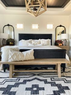 a large bed sitting in a bedroom on top of a rug