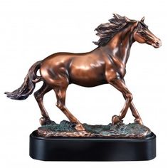 a bronze statue of a horse on a black base