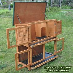 a large wooden box with two cages inside