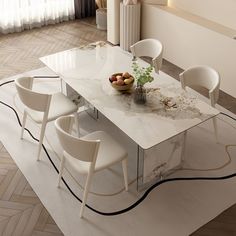 a dining table with chairs around it and a vase filled with fruit on the top