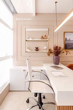 an office with a desk, chair and shelves