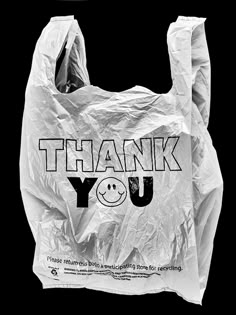 a plastic bag with the words thank you written on it