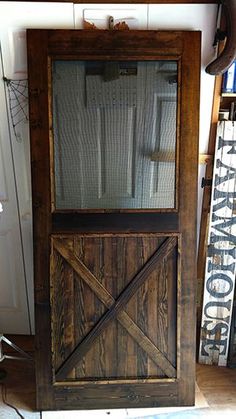 an old wooden door with glass on it