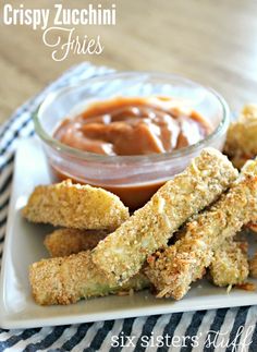 crispy zucchini fries on a plate with dipping sauce