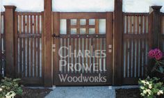 a wooden gate with the words charles browne wood works painted on it's side