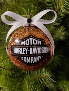 an ornament hanging from a christmas tree that says motor harley - davidson company