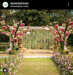 an outdoor wedding setup with flowers and greenery