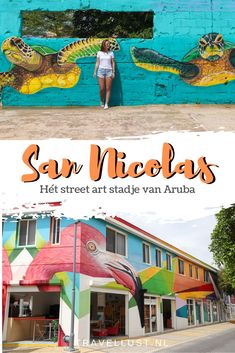 a woman standing in front of a colorful building with the words san nicholas on it