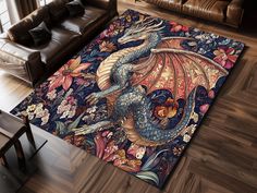 a living room area rug with a blue dragon on the floor and flowers around it