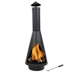 an outdoor fireplace with flames on the side and a black chimney top, next to it