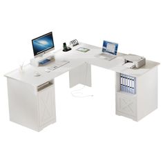 a computer desk with two computers on it