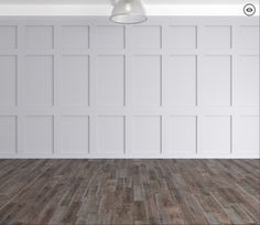 an empty room with white walls and wood flooring is shown in this image, there is