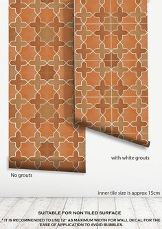 an orange and brown wallpaper with white grouting on the walls, in front of