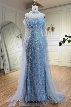 Neckline: High NeckSilhouette: MermaidSleeve Length: Ruffle SleevesEmbellishment: Beads, Pearls Avatar Wedding, Turtle Neck Gown, Blue Graduation Gown, Debs Dresses, Pearl Mermaid, Charity Ball, Dream Prom, Winter Formal Dresses, Fantasy Wardrobe