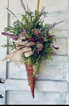 a bunch of flowers that are on the side of a door with burlocks