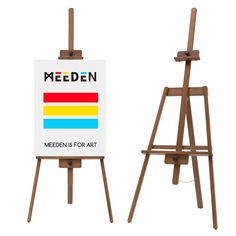 a wooden easel with a sign on it that says meeden is for art