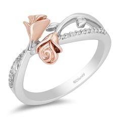 The ring that gets a lot of compliments. Why would anyone not notice this beauty? Crafted from 14k rose gold over sterling silver, here is a ring inspired by Belle and exudes her fierce but kind and gentle but strong character. Featuring a bypass shank with sides lined in diamonds and a centerpiece of meeting roses, the interesting design of this ring is meant to start conversations and leave impressions. Enchanted Jewelry, Enchanted Disney, Enchanted Disney Fine Jewelry, Disney Fine Jewelry, Rose Fashion, Jewelry Roll, Bridal Jewelry Collection, Diamond Fashion Rings, Unique Diamond Rings