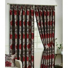 a living room curtain with red flowers on it