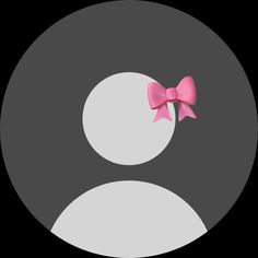 a pink bow sitting on top of a black and white circle