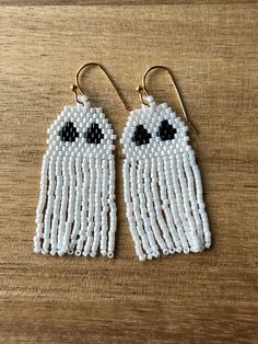 white beaded ghost earrings with black eyes