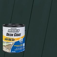 a can of rock solid deck coat sitting on top of a green wooden fence post