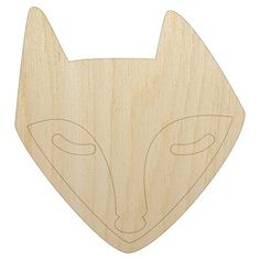 a wooden cutout of a fox's head