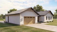 a two car garage sits in the middle of a grassy area next to a house