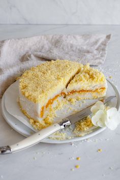 a piece of cake sitting on top of a plate next to a knife and fork