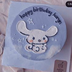 a birthday cake with an image of a mouse on it