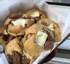 chocolate chip cookies with white cream in a basket