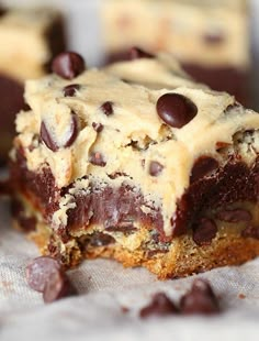 two pieces of chocolate chip cookie cake sitting on top of a piece of parchment paper