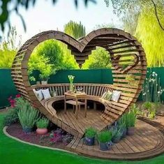 a heart shaped bench in the middle of a garden