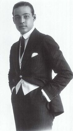 an old photo of a man in a suit and tie