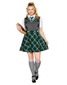 a woman dressed in a green and white plaid dress is holding a piece of bread