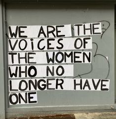 a sign on the side of a building that says we are the voices of the women who no longer have one