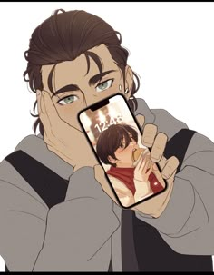 a man holding a cell phone up to his face and looking at the screen with an anime character on it