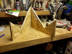 a wooden object sitting on top of a workbench