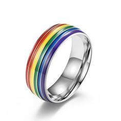 Description & Details They appear as perfect arcs, often during a rainstorm when the sun shines onto water droplets, shattering its white light into an array of brilliant colors. High quality titanium stainless steel Hypoallergenic, gold plating 8 mm wide US size 7 - 12 available Lesbian Wedding Bands, Gay Jewelry, Rainbow Flag Lgbt, Couple Band, Rainbow Ring, Rainbow Rings, Rainbow Flag, Water Droplets, Womens Wedding Bands